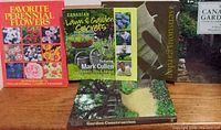 Front covers and spines of five gardening books on a shelf