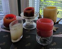 Overview of candles arranged on tray by window