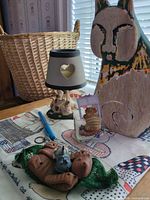 Group shot showing wooden cat cutout, terracotta hammock cat, Seagull candle, hugging mice