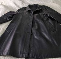 Full view of black leather 3/4 length jacket laid flat
