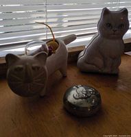 Group shot showing ceramic cat planter with fishbowl, white cat tin, and pewter trinket box