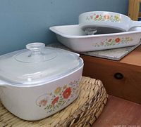 Skillet, casserole with lid, and rectangular dish grouped together showing floral pattern