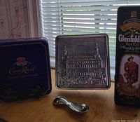 Front view of three tins displayed together