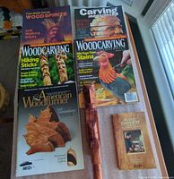 Group shot of magazines, books, staff, plaque