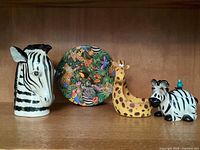 All four decorative items displayed together