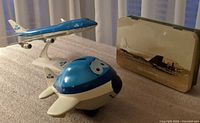 KLM 747 model, blue piggy bank, DC-4 tin group