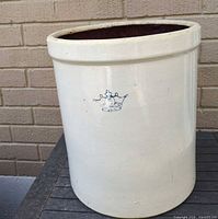 Full view of cream stoneware crock with blue crown 5 USA mark