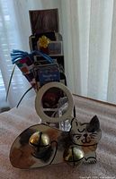 Group view of cat hanger, crystal vase and bookmarks