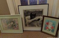 All three framed cat prints standing together for scale and variety