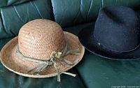 Both hats side by side on couch