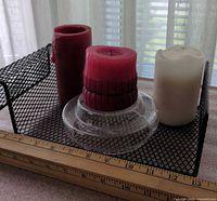 Candles, glass holder and mesh tray grouped together