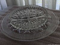 Both glass plates stacked, showing size difference and patterns