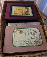 Basket containing photo album, notebook and others