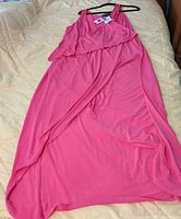 Full dress laid flat showing front, overlay and hem