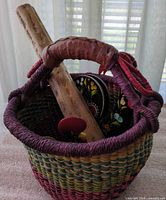 Overall view showing basket, rainstick and rooster items inside