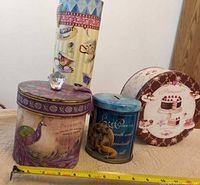 Group shot of all four decorative containers showing size comparison and designs