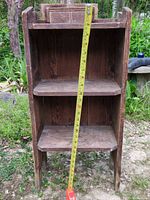 Front view of shelf with tape measure indicating 28 inch height