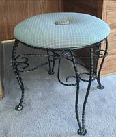 Full view of stool standing upright