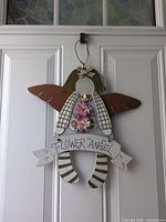 Full view of angel wall hanging on door