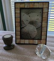 Front view of frame with stone holder and glass paperweight