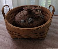 Basket holding ceramic vessel