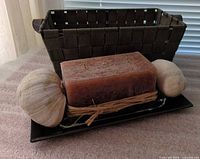 Entire lot showing basket, soap block on dish and tray, two seashells