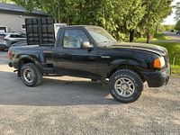 Driver side profile of 2002 Ford Ranger Edge showing stepside bed, wheels and overall condition