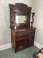 Full view of buffet with hutch showing mirror, drawers, doors