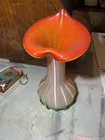 Full view of vase showing color gradient and ribbed body