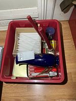 Top view of bin showing candles, vase, holders, tin