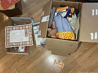 Boxed lot showing fabric, heating pad box, smaller box with tools and stencils