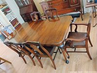 Dining table with six chairs grouped around