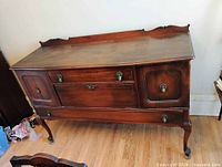 Full front view of Gibbard walnut sideboard showing structure and finish