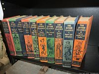 Front spines of complete 10 volume Junior Classics set on shelf