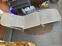 Full view of folded-out mesh chaise lounge