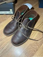 Top view of both boots showing uppers, laces, and minimal wear