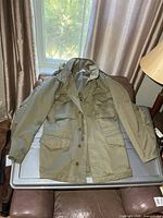 Full view of coat front on table