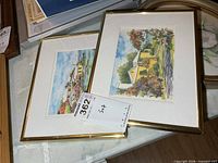 Both framed signed prints with mats and gold frames