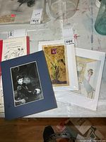 Overall view of three prints on table