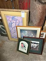 Group of four framed prints leaning together