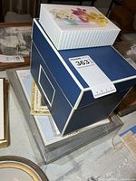 Stack showing blue box, floral box, packaged writing paper