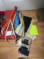 Toolbox, strap wrench, extension cord, gloves visible on floor