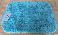 Full view of turquoise Mohawk bath rug