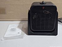 Front view of heater fan and manual