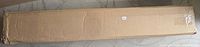 Cardboard box containing mantel shelf