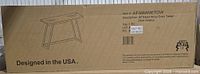 Full view of boxed console table showing illustration and branding