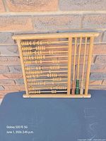 Full view of wooden abacus front, beads centered