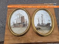 Both oval convex frames side by side on table