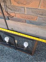 Full length view showing three bulb sockets and measuring tape indicating ~35 in length