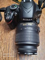 Front view Nikon D3200 with 18-55 mm lens and UV filter
